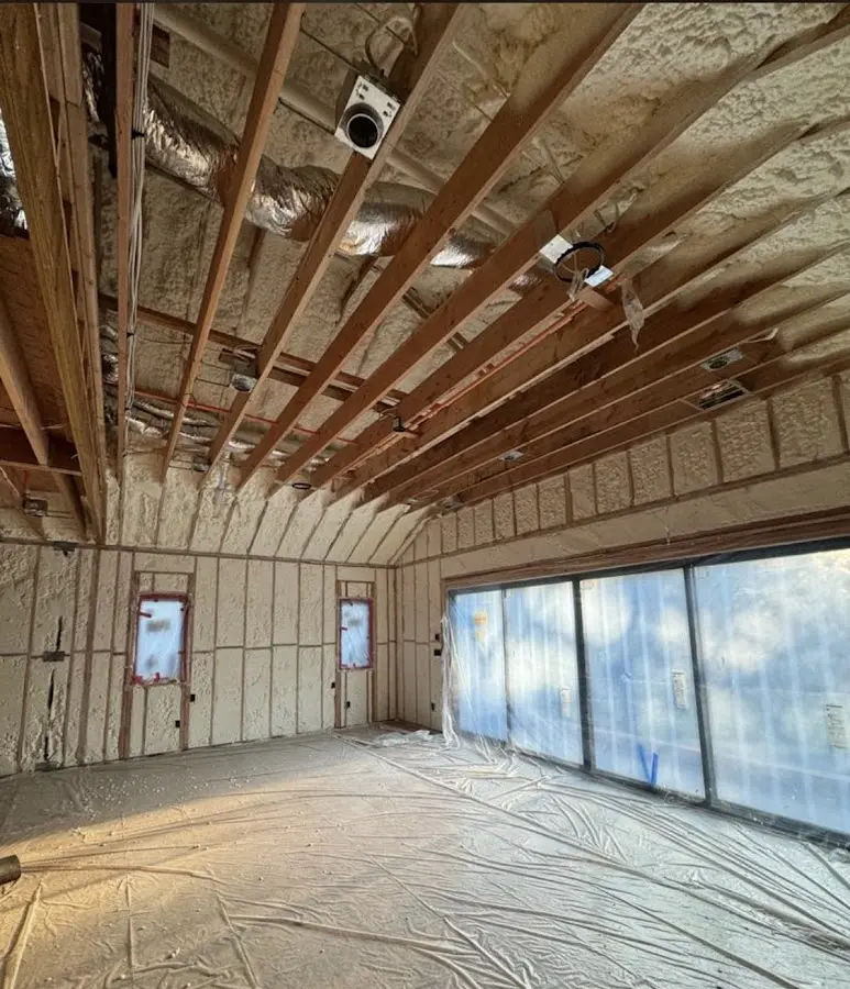 Interior walls and ceiling insulated with spray foam during new construction in Delta